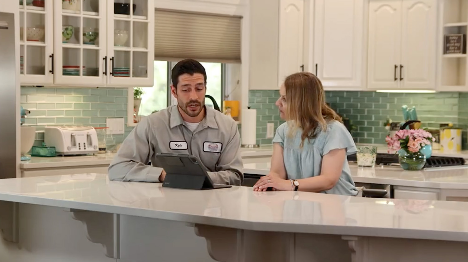 M&M technician consulting with homeowner about leak detection