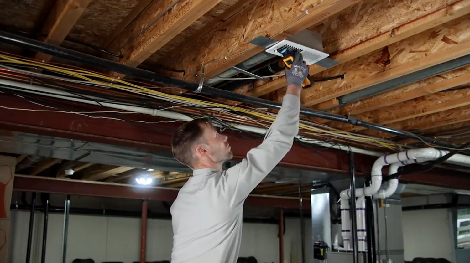 M&M technician installing ductwork