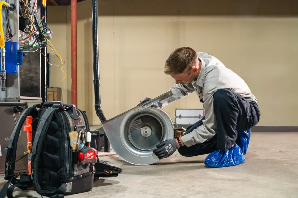 M&M technician performing a furnace tune-up