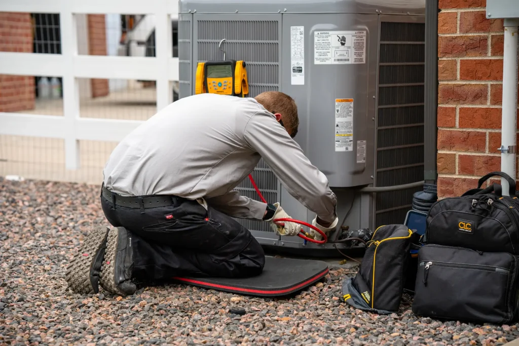 M&M technician performing an AC tune-up