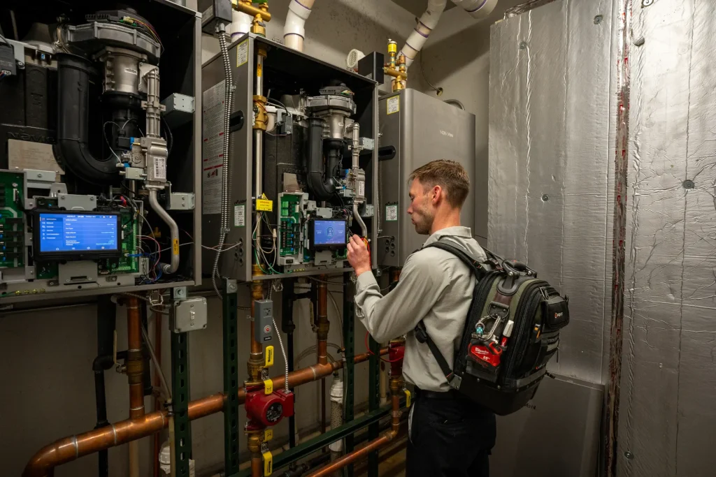 M&M technician servicing a residential boiler