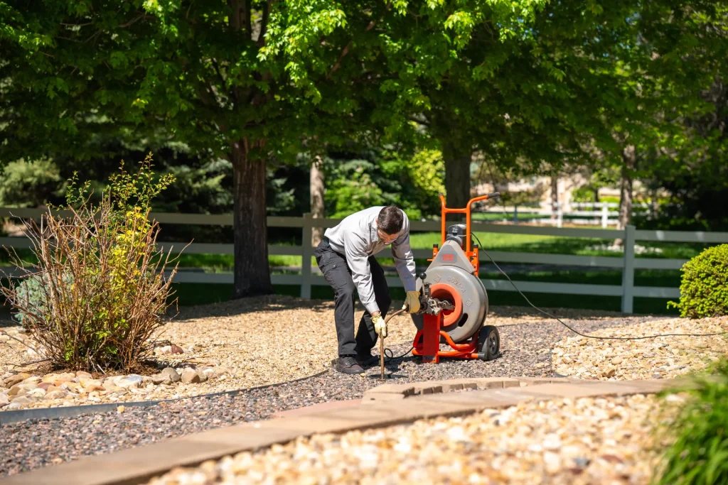 M&M plumber working on a main service line