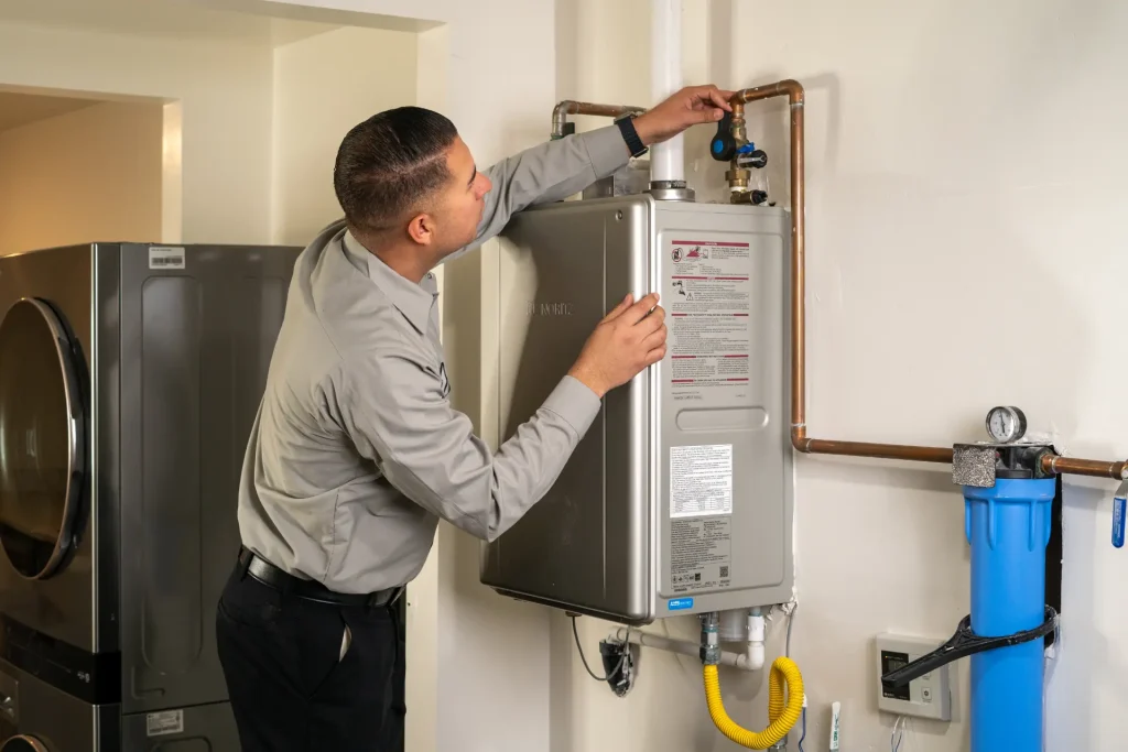 M&M plumber installing a water heater